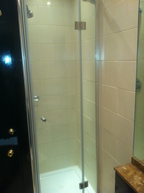 Frameless glass shower enclosure with chrome fittings in Camden Town