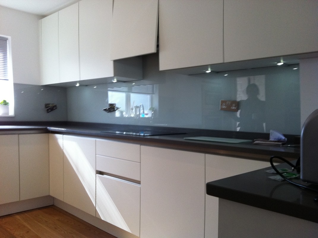 Grey glass kitchen splashback with LED lighting in Camden Town
